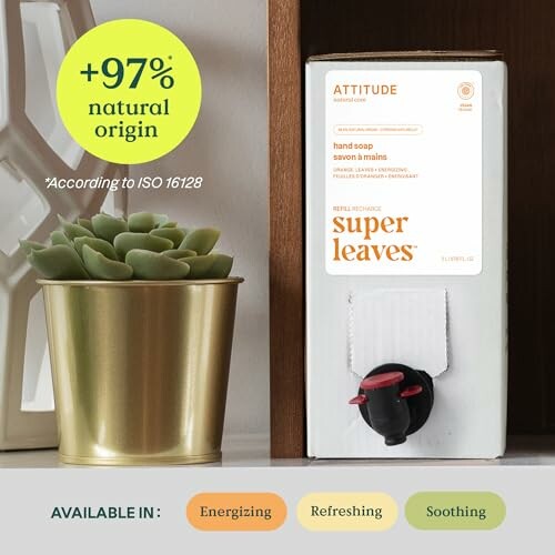 Hand soap dispenser next to a potted plant with text about natural origin.